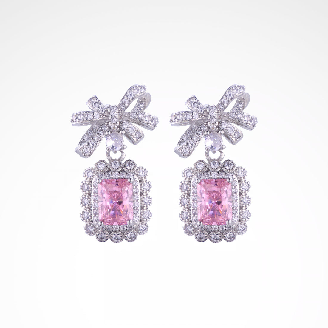 Enchanted Blush Radiant Bow Drop Earrings, white-gold plated copper with zircon stones with a white background