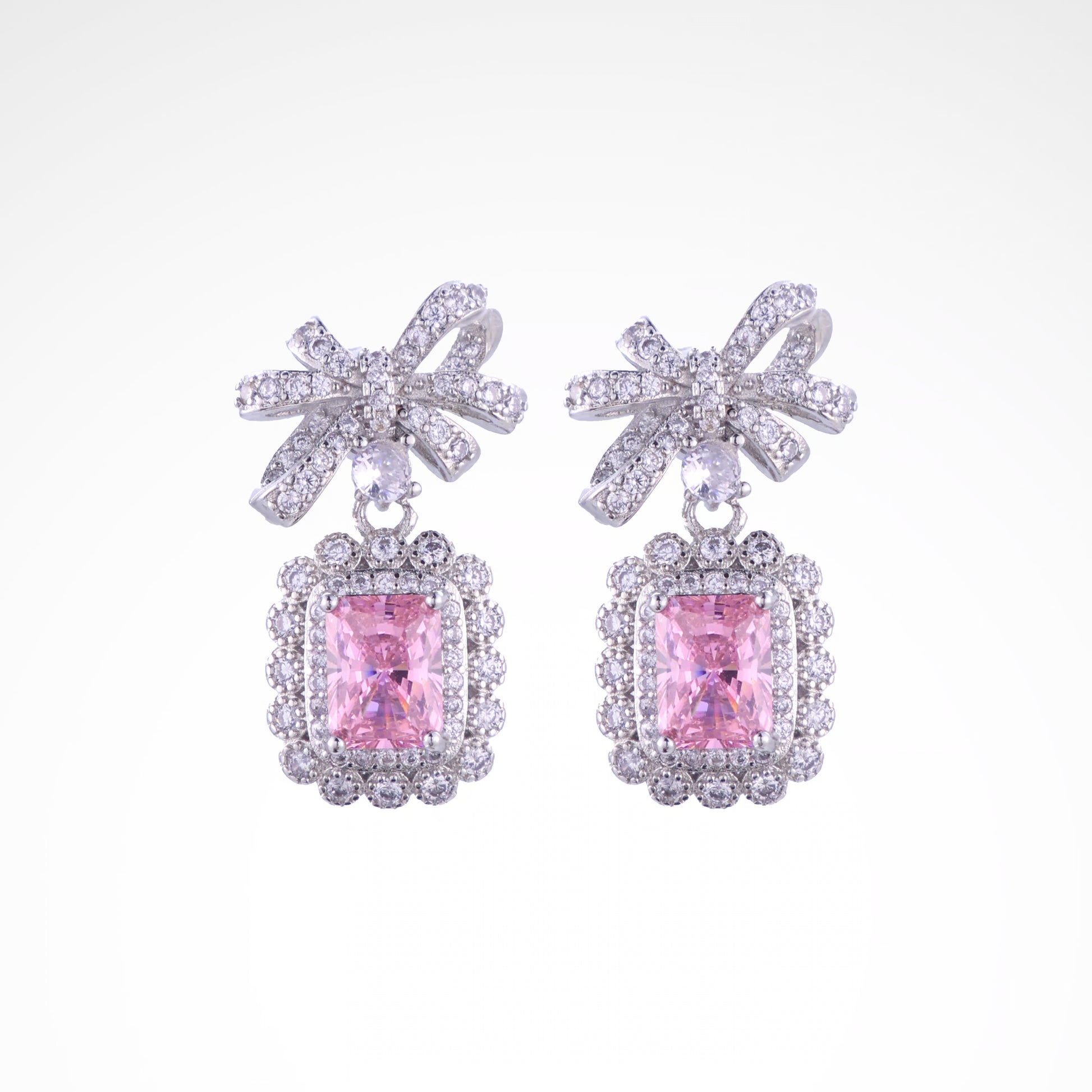 Enchanted Blush Radiant Bow Drop Earrings, white-gold plated copper with zircon stones with a white background