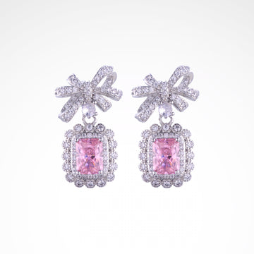 Enchanted Blush Radiant Bow Drop Earrings, white-gold plated copper with zircon stones with a white background