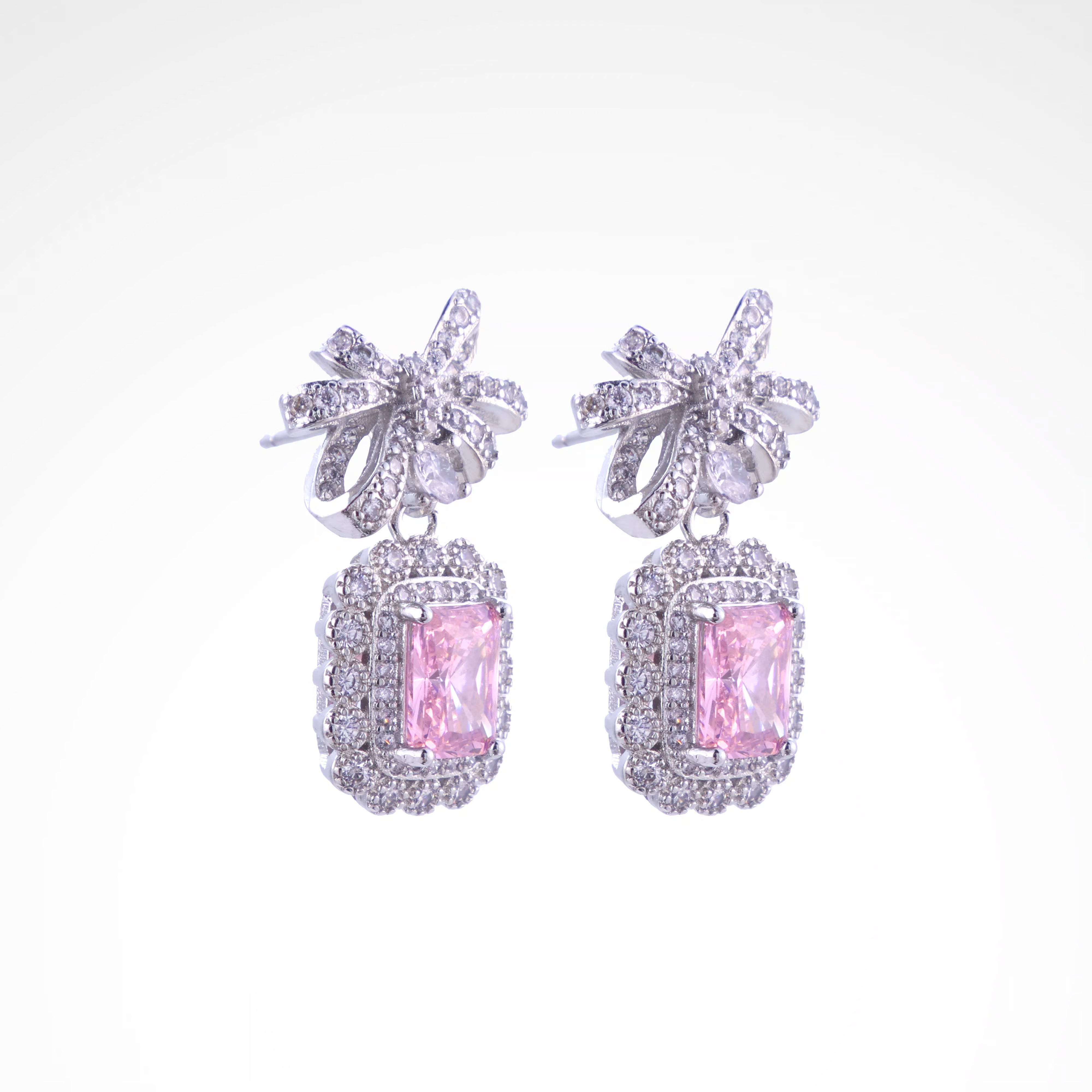 Enchanted Blush Radiant Bow Drop Earrings, white-gold plated copper with zircon stones with a white background