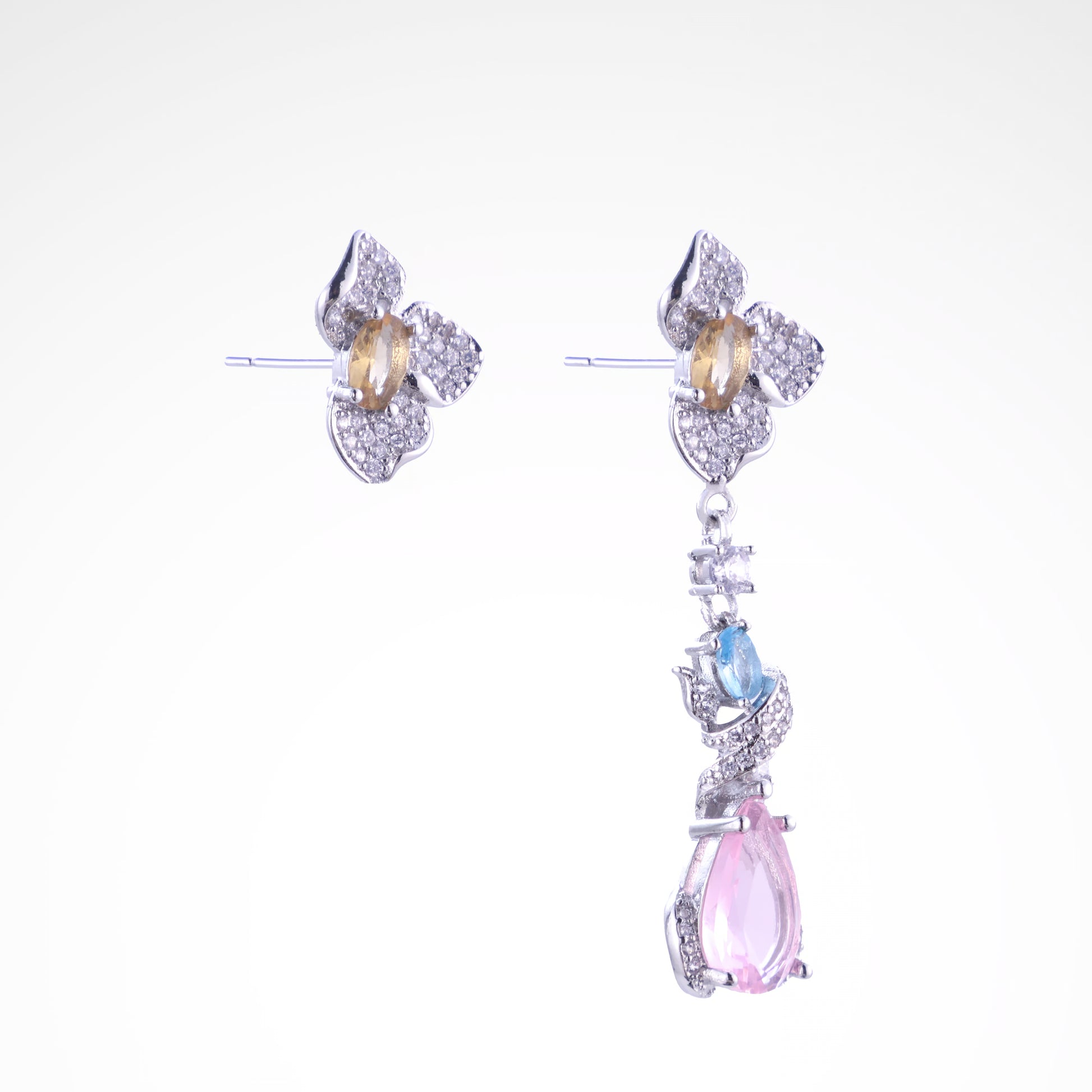 Enchanted Garden Pastel Asymmetrical Drop Earrings, white-gold plated copper with zircon stones with a white background