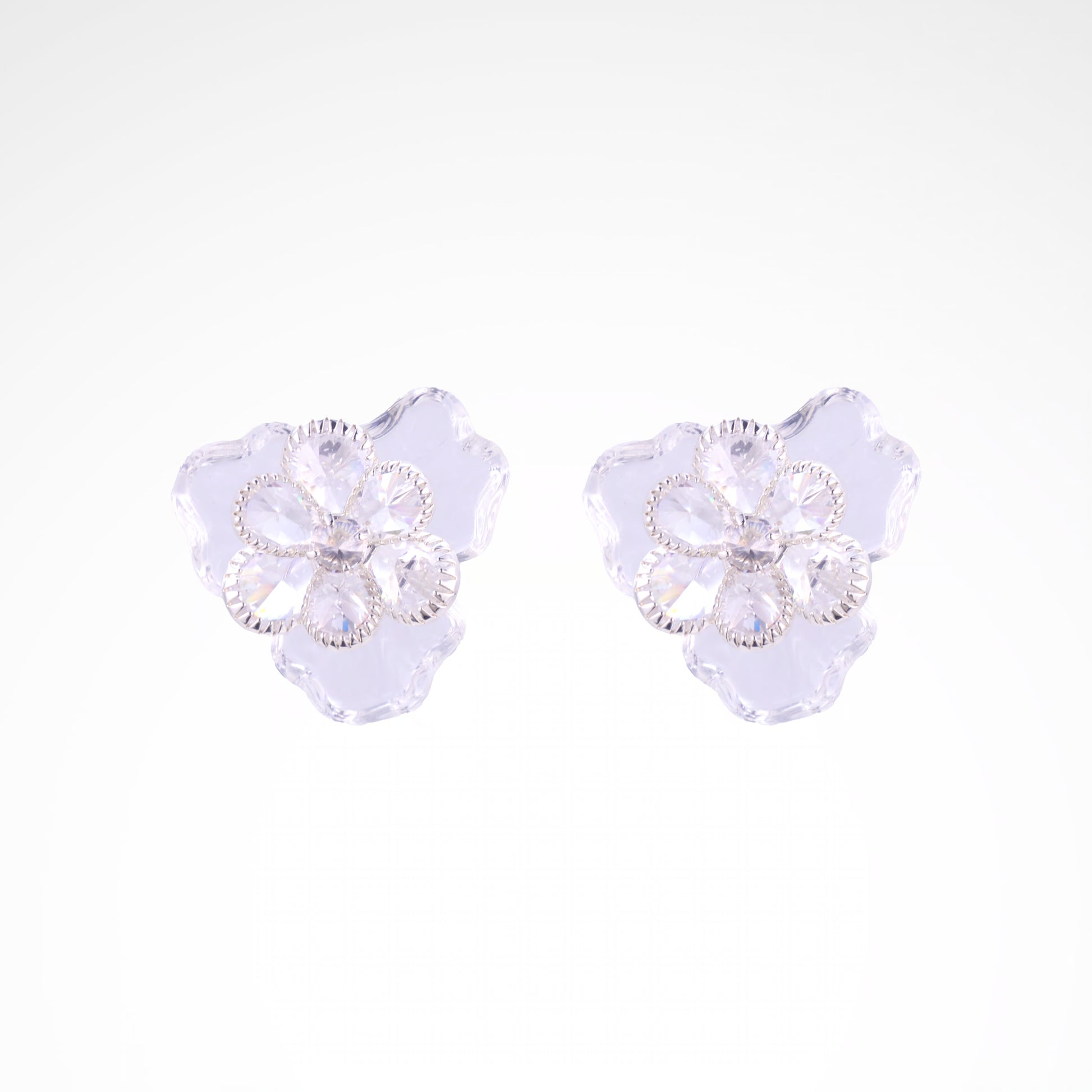 Ethereal Frost Crystal & Acrylic Petal Stud Earrings, white-gold plated copper with zircon stones with a white background