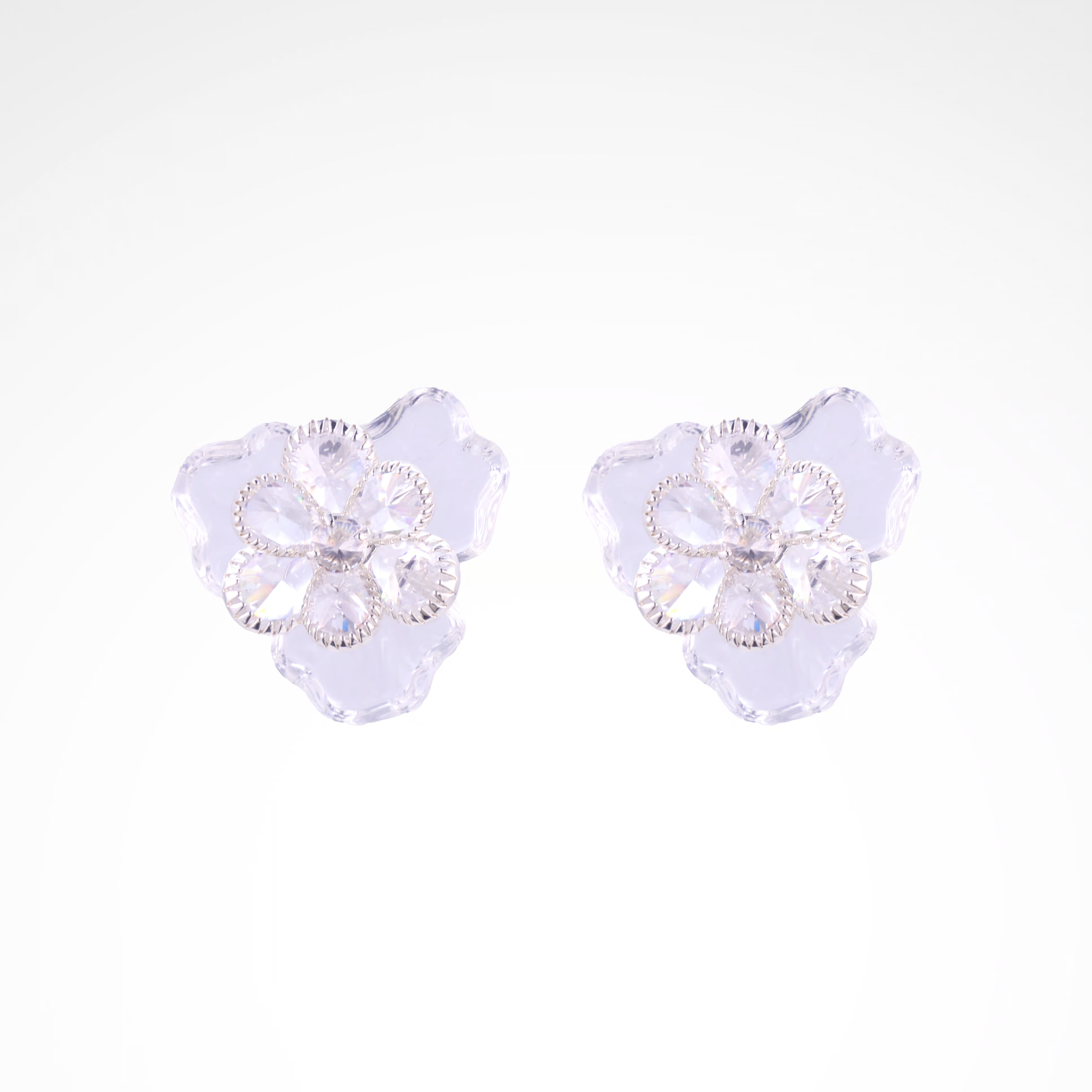 Ethereal Frost Crystal & Acrylic Petal Stud Earrings, white-gold plated copper with zircon stones with a white background