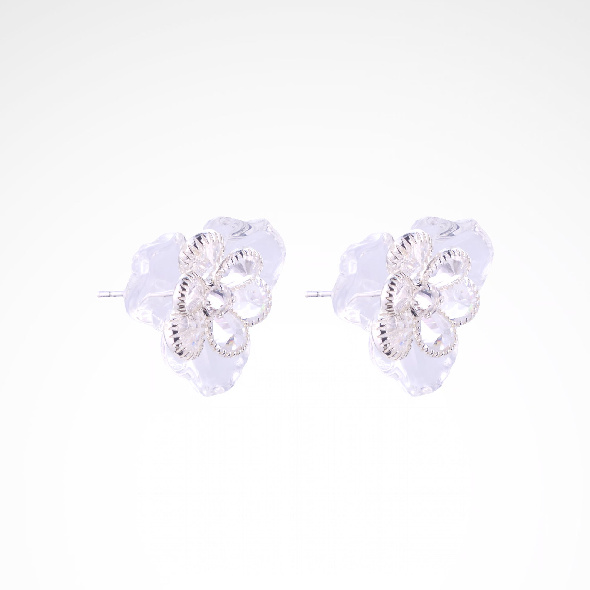 Ethereal Frost Crystal & Acrylic Petal Stud Earrings, white-gold plated copper with zircon stones with a white background