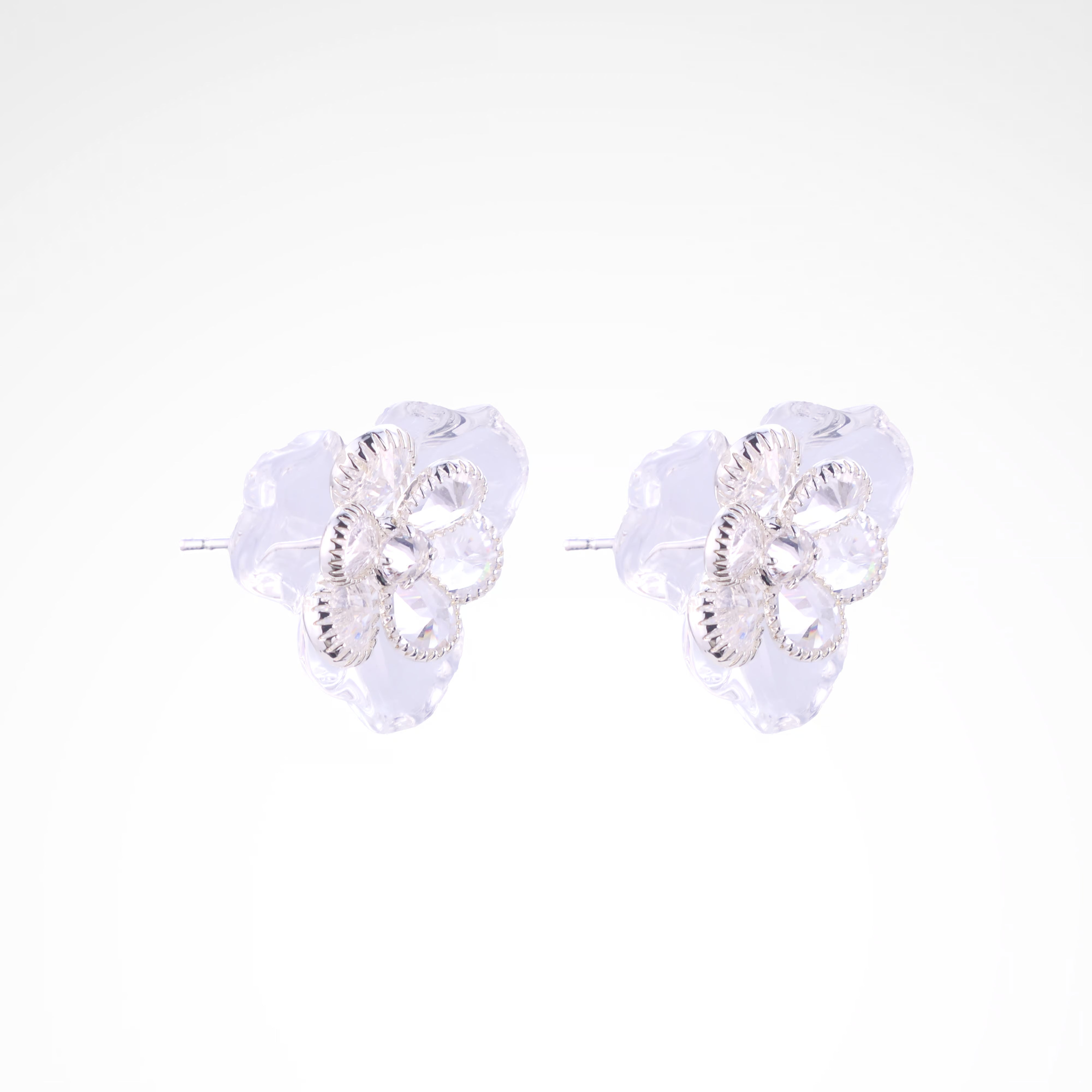 Ethereal Frost Crystal & Acrylic Petal Stud Earrings, white-gold plated copper with zircon stones with a white background