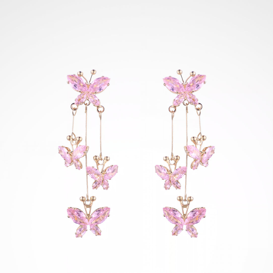 Fluttering Blush Crystal Butterfly Cascade Earrings, white-gold plated copper with zircon stones with a white background
