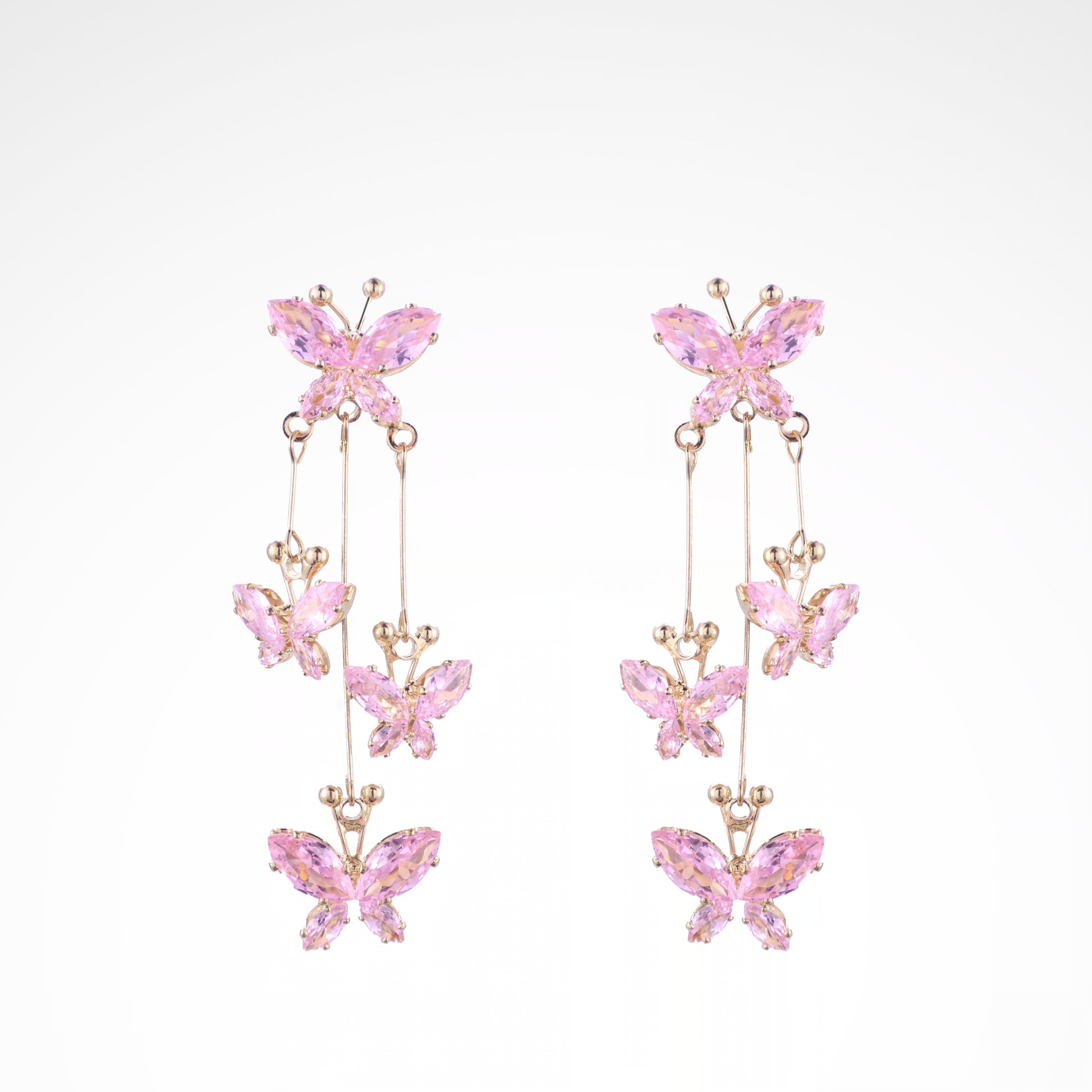 Fluttering Blush Crystal Butterfly Cascade Earrings, white-gold plated copper with zircon stones with a white background
