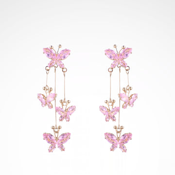 Fluttering Blush Crystal Butterfly Cascade Earrings, white-gold plated copper with zircon stones with a white background