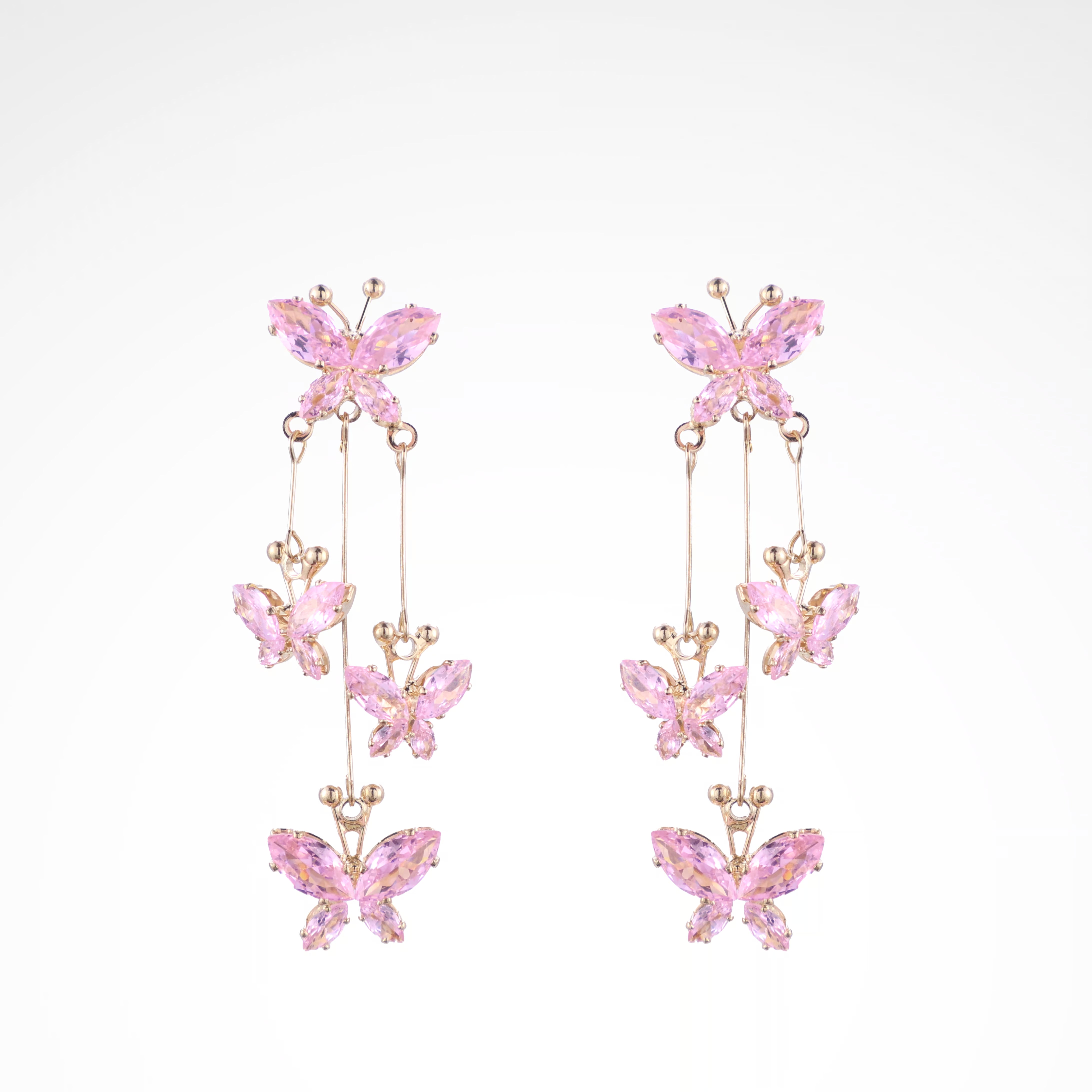 Fluttering Blush Crystal Butterfly Cascade Earrings, white-gold plated copper with zircon stones with a white background