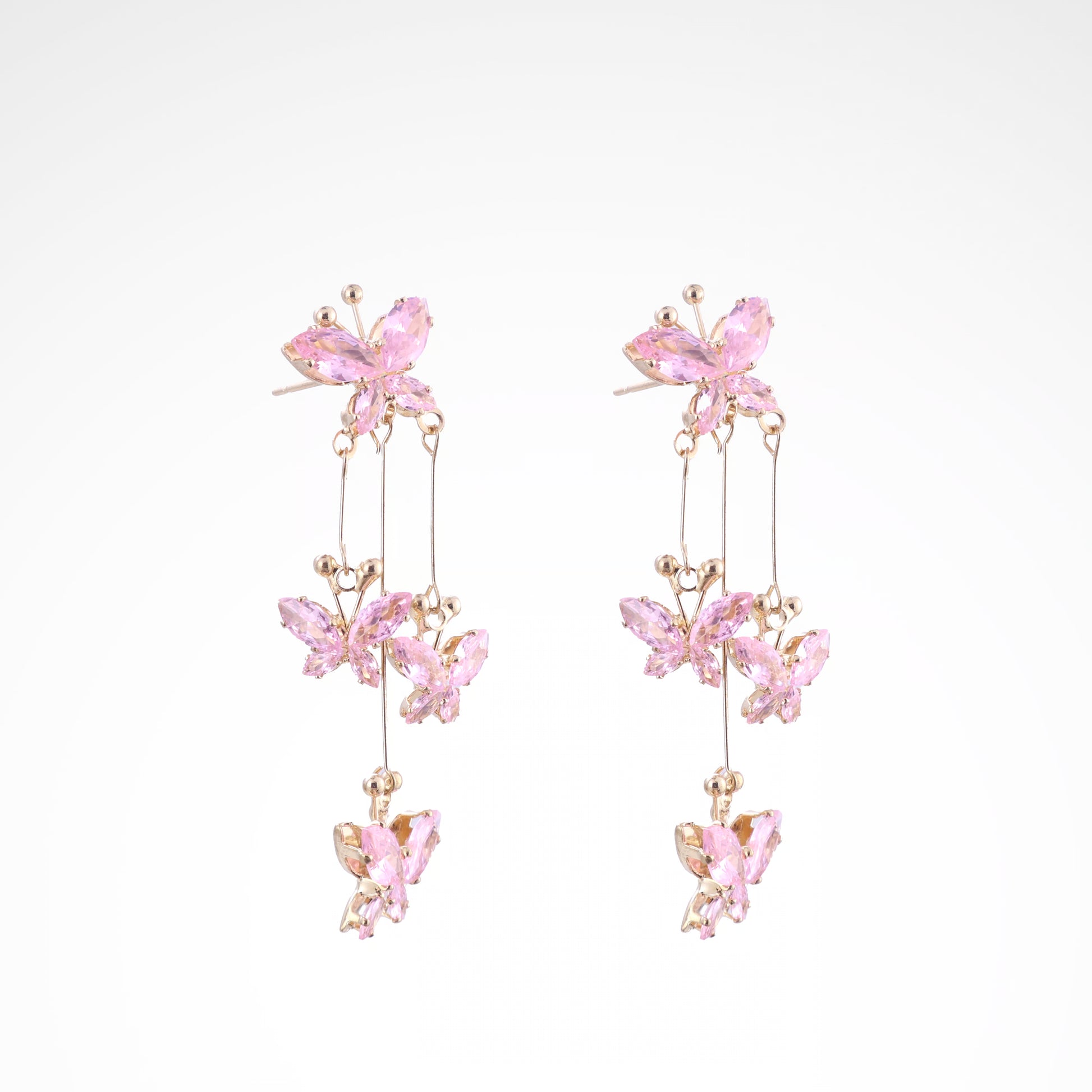 Fluttering Blush Crystal Butterfly Cascade Earrings, white-gold plated copper with zircon stones with a white background
