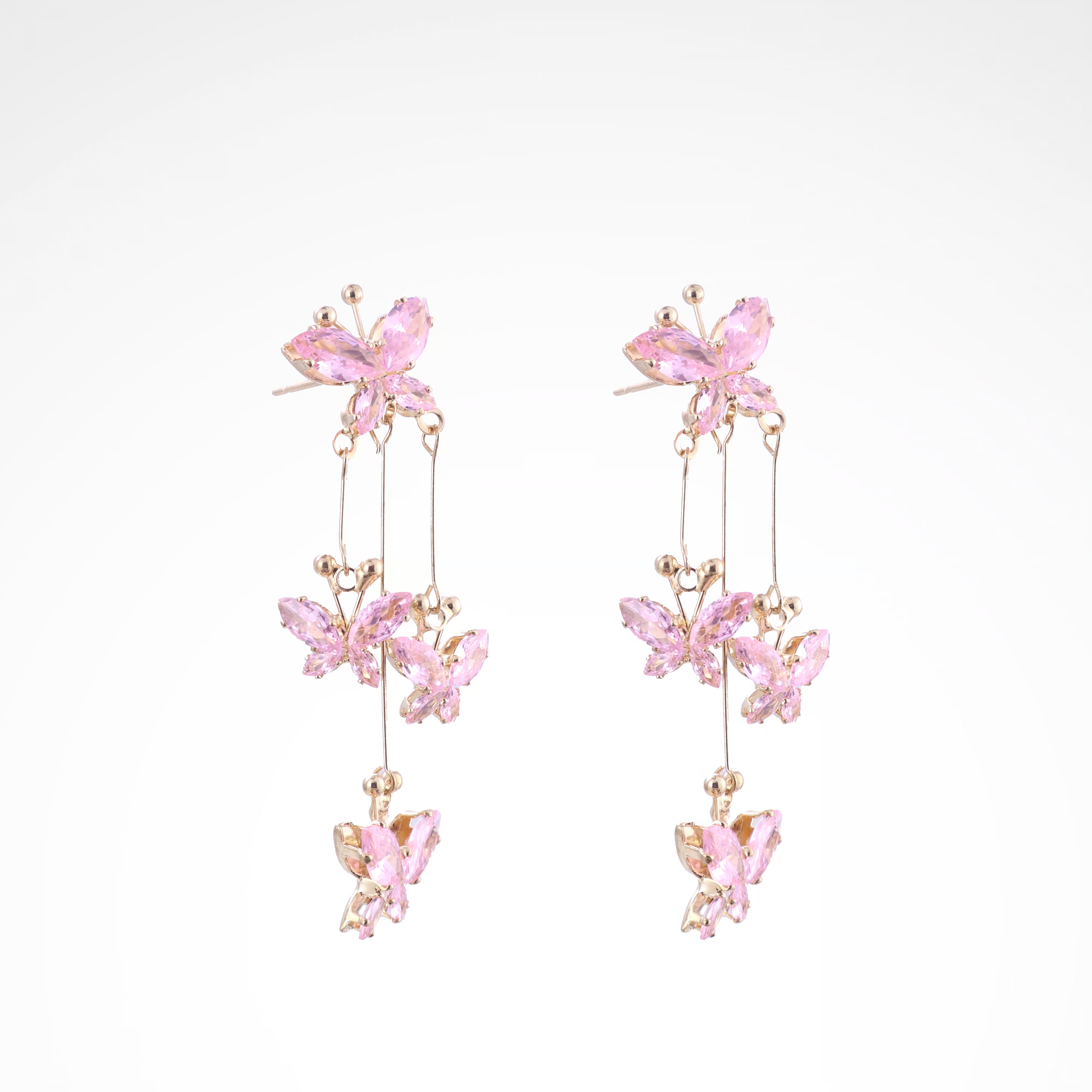 Fluttering Blush Crystal Butterfly Cascade Earrings, white-gold plated copper with zircon stones with a white background