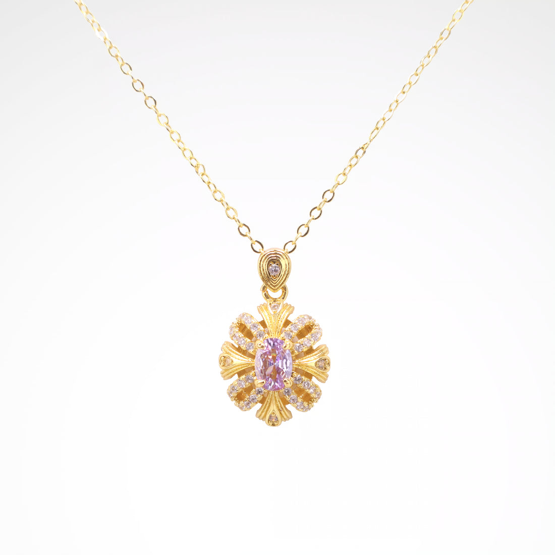 Imperial Lavender Gold-Tone Ribbon Pendant Necklace, gold plated copper with zircon stones with a white background