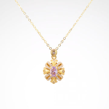 Imperial Lavender Gold-Tone Ribbon Pendant Necklace, gold plated copper with zircon stones with a white background