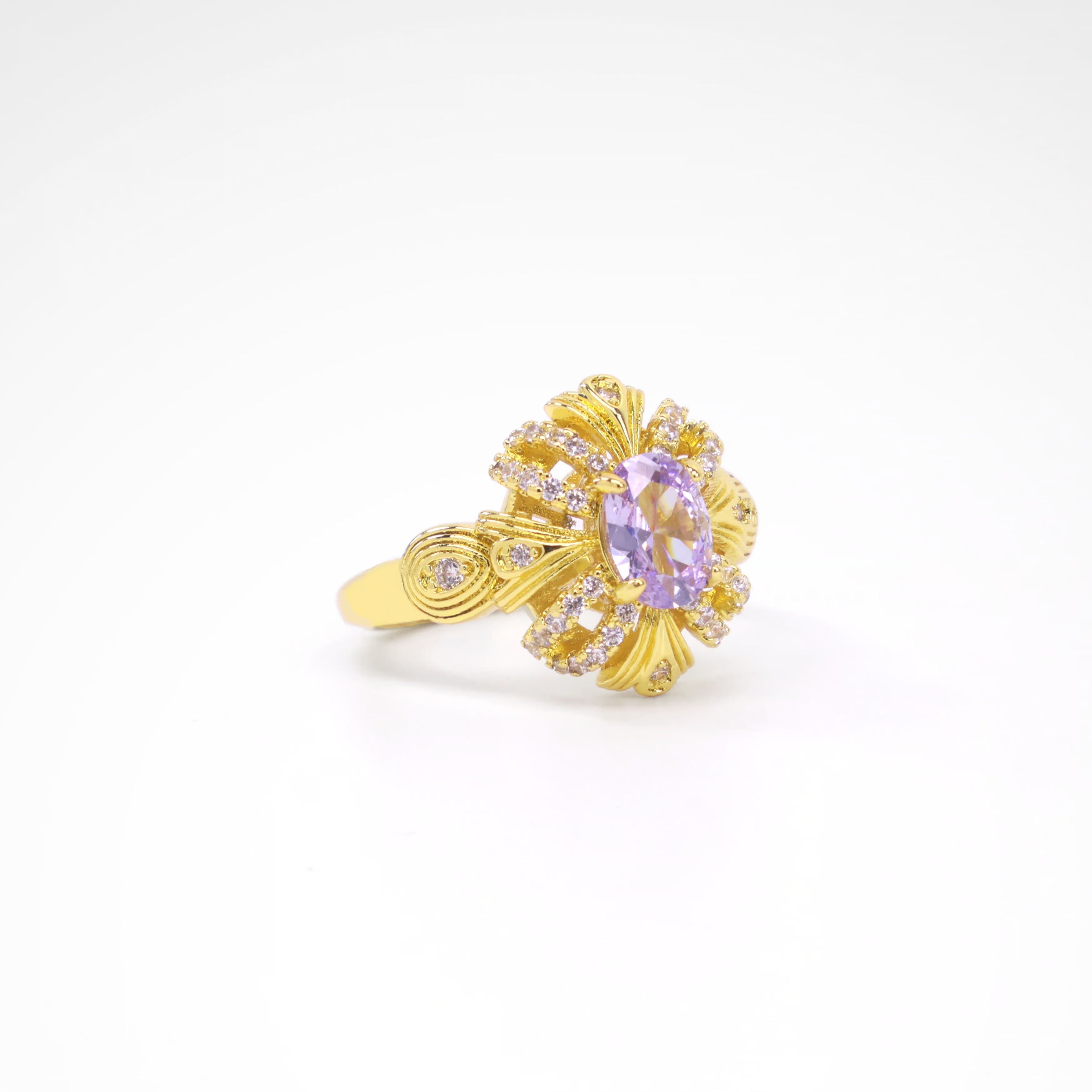 Imperial Lavender Gold-Tone Ribbon Ring, gold plated copper with zircon stones with a white background