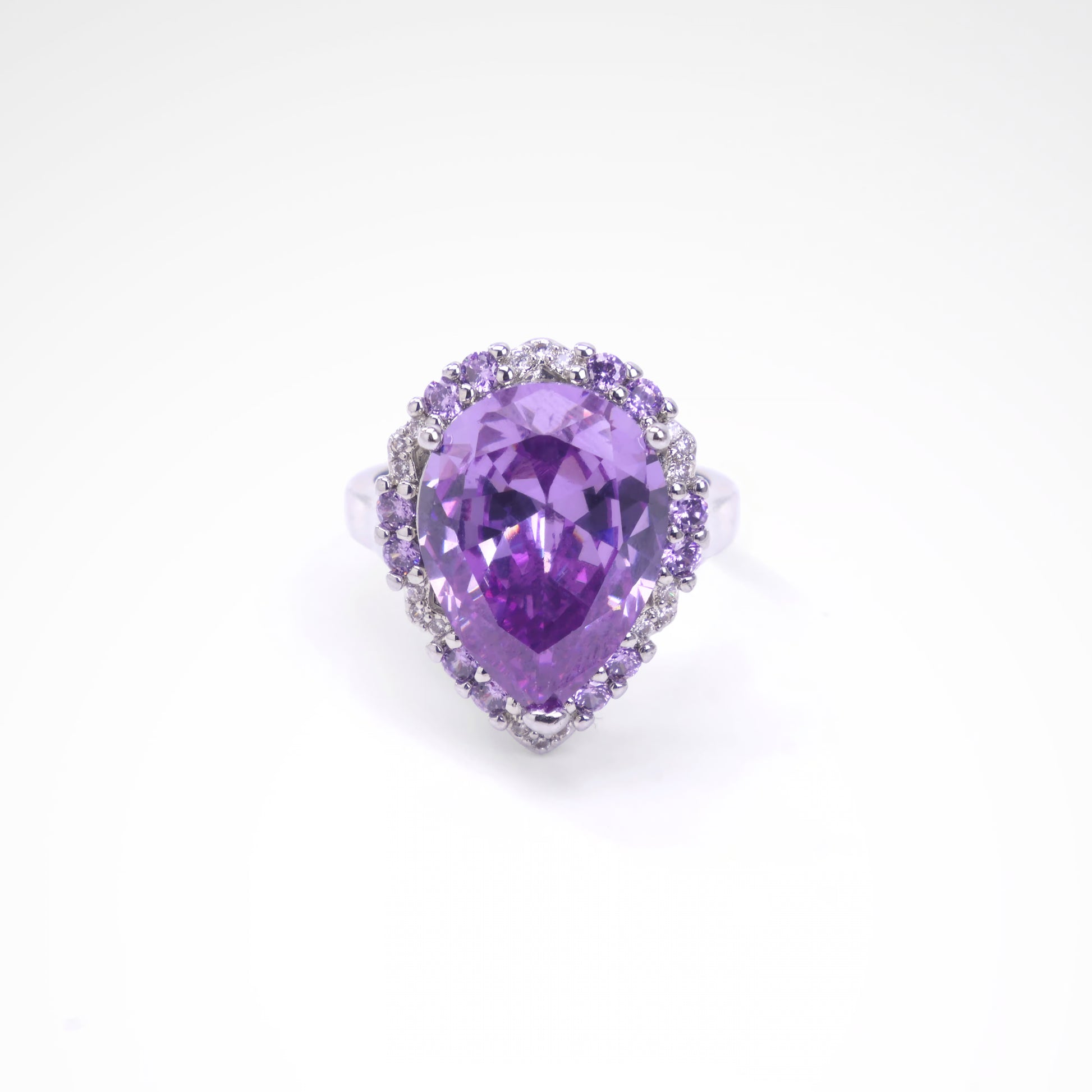 Majestic Violet Pear-Cut Halo Cocktail Ring, white-gold plated copper with zircon stones with a white background