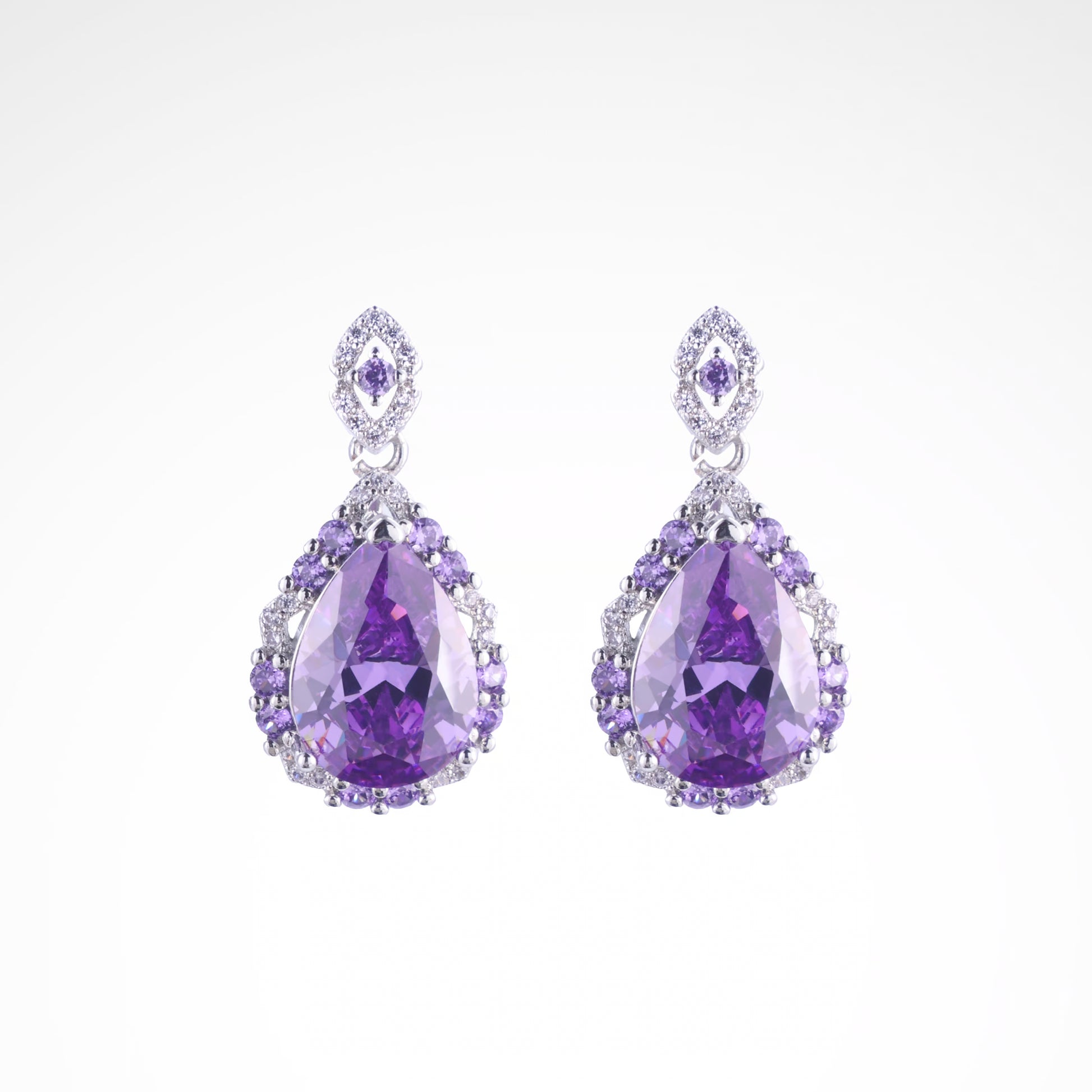 Majestic Violet Pear-Cut Halo Drop Earrings, white-gold plated copper with zircon stones with a white background