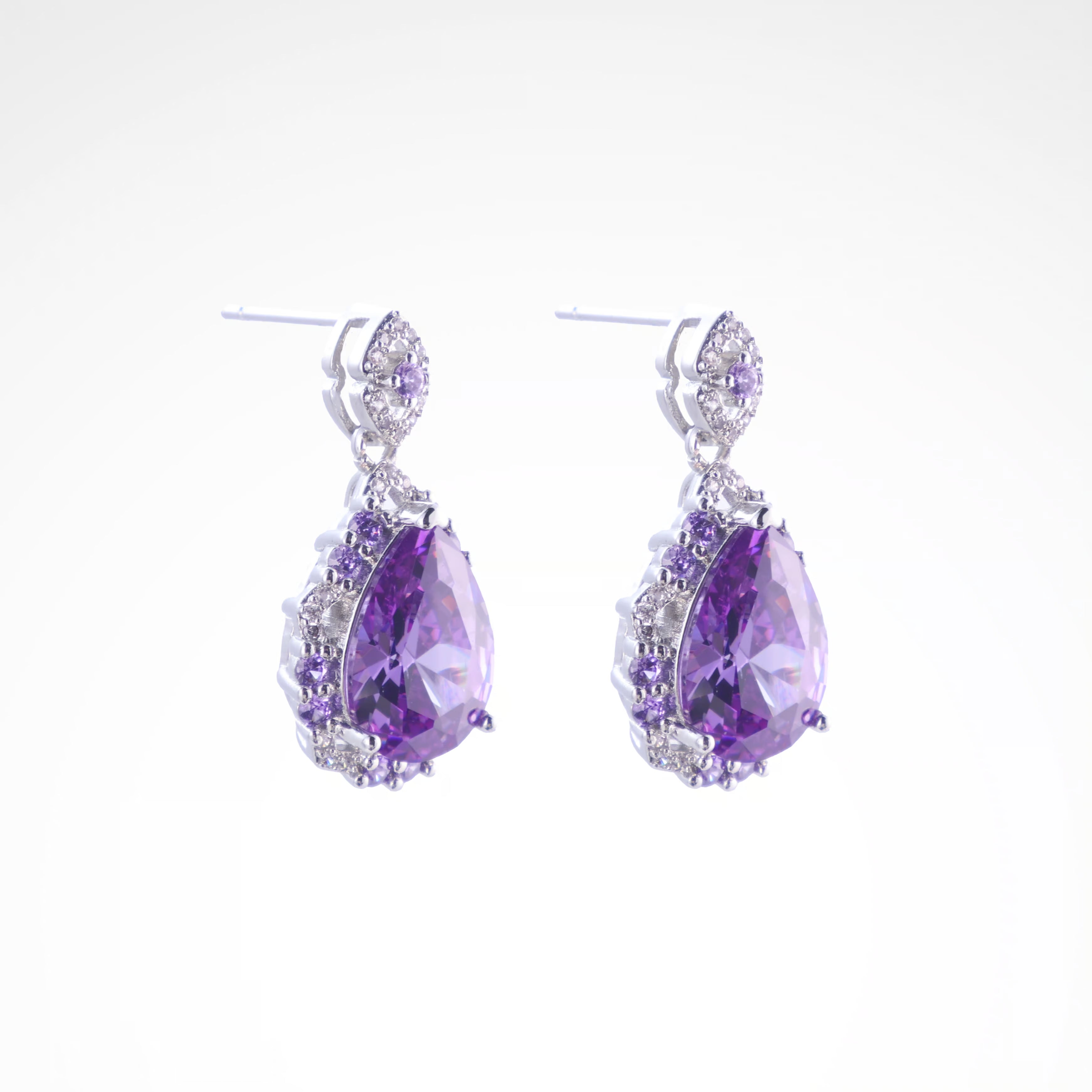 Majestic Violet Pear-Cut Halo Drop Earrings, white-gold plated copper with zircon stones with a white background