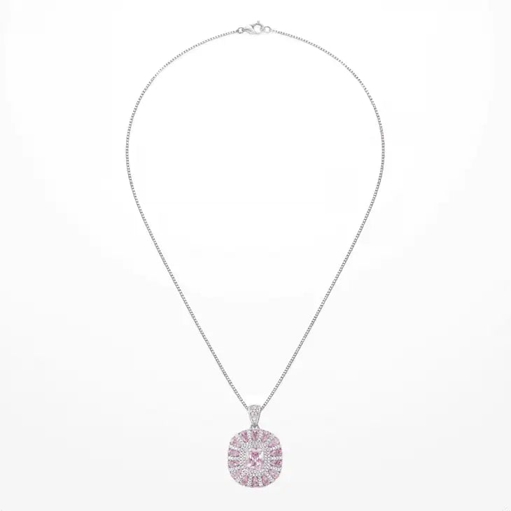 A white gold plated chain necklace with a round pendant set with pink and clear zircons, displayed against a plain white background.