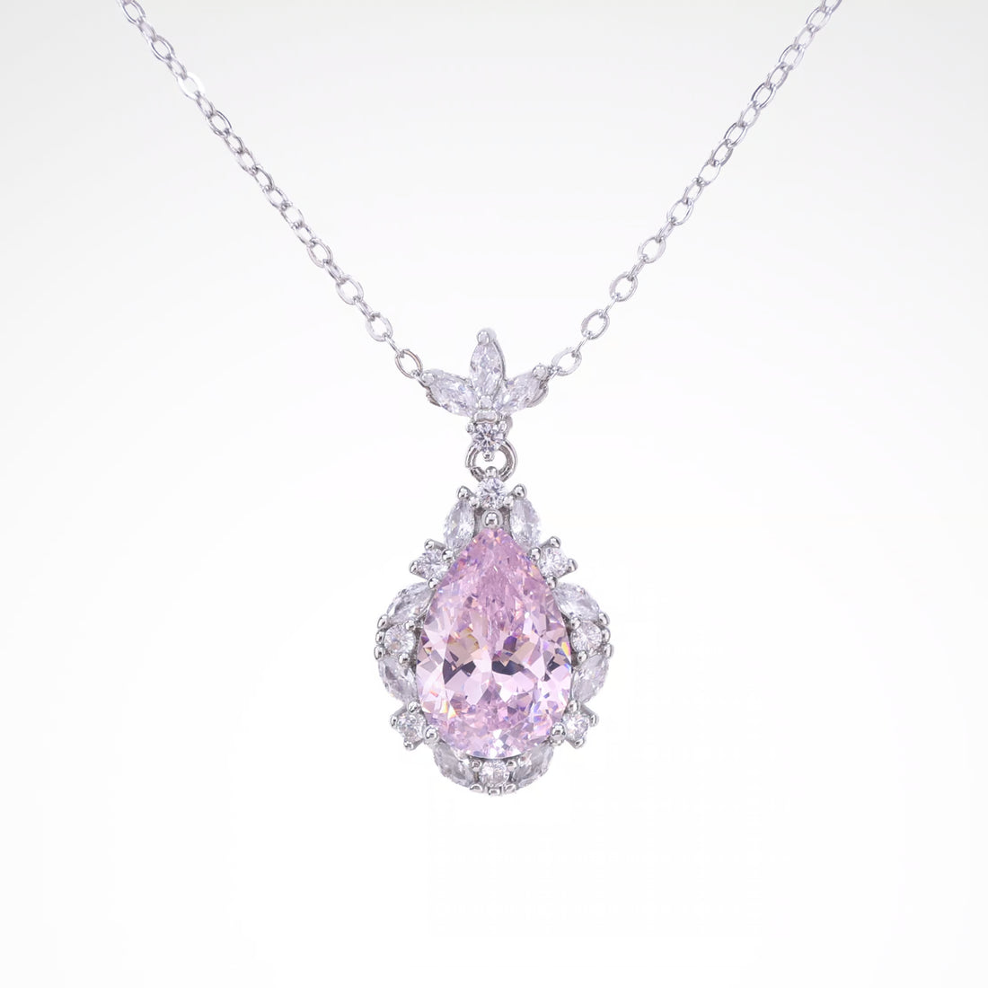 Radiant Blush Pear-Cut Halo Pendant Necklace, white-gold plated copper with zircon stones with a white background