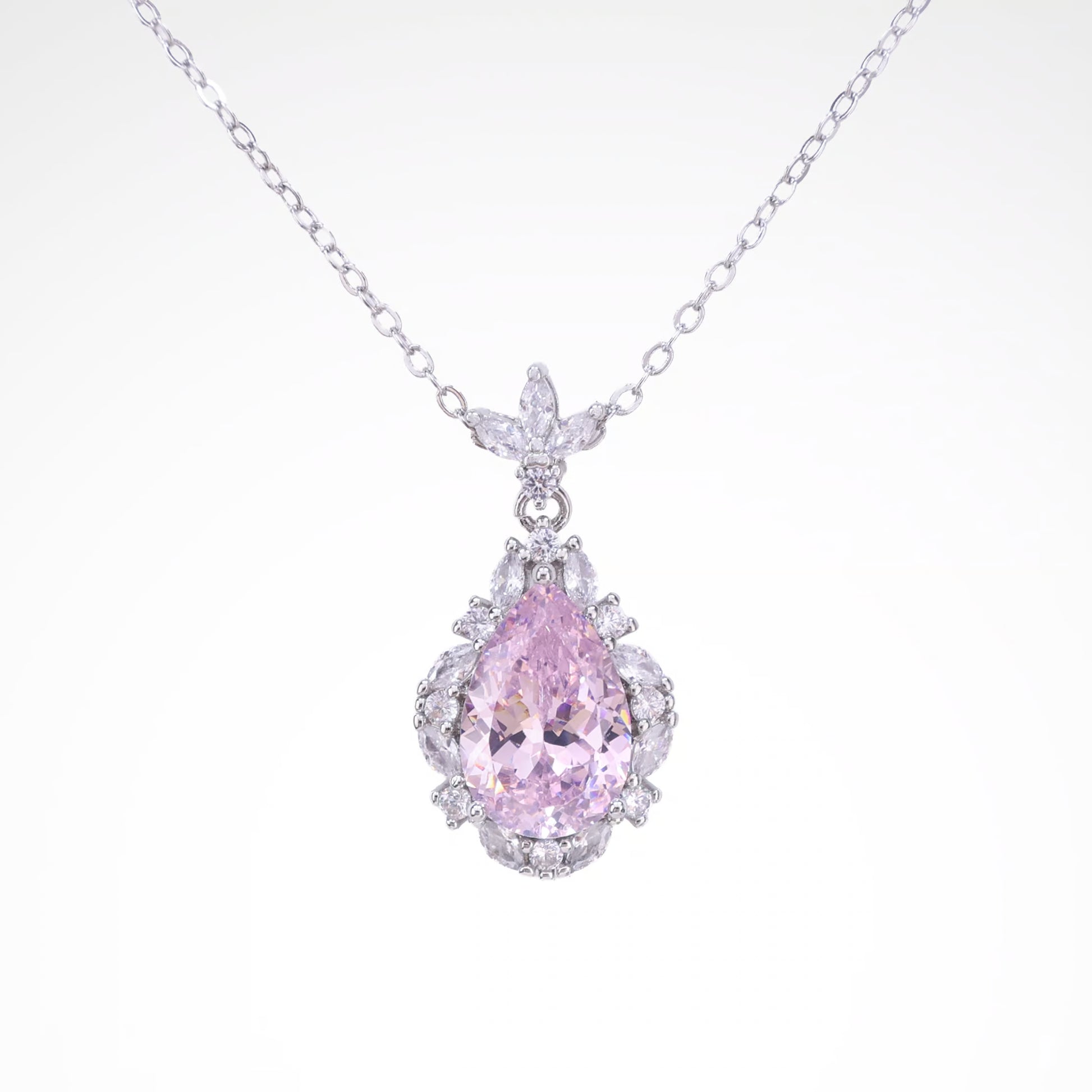 Radiant Blush Pear-Cut Halo Pendant Necklace, white-gold plated copper with zircon stones with a white background