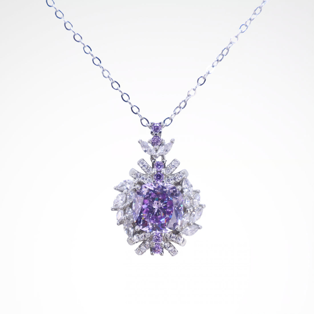 Regal Violet Cushion-Cut Floral Pendant Necklace, white-gold plated copper with zircon stones with a white background