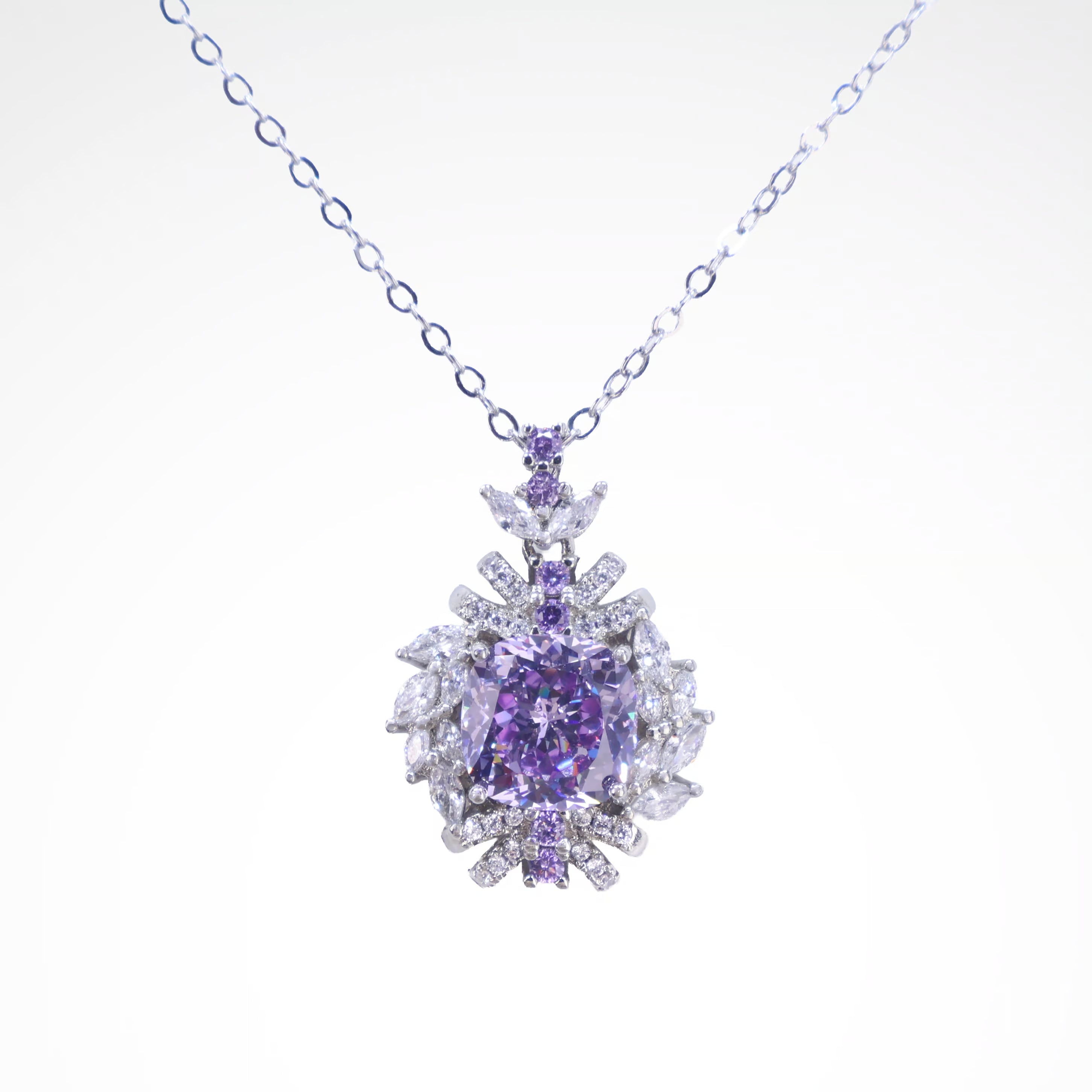 Regal Violet Cushion-Cut Floral Pendant Necklace, white-gold plated copper with zircon stones with a white background