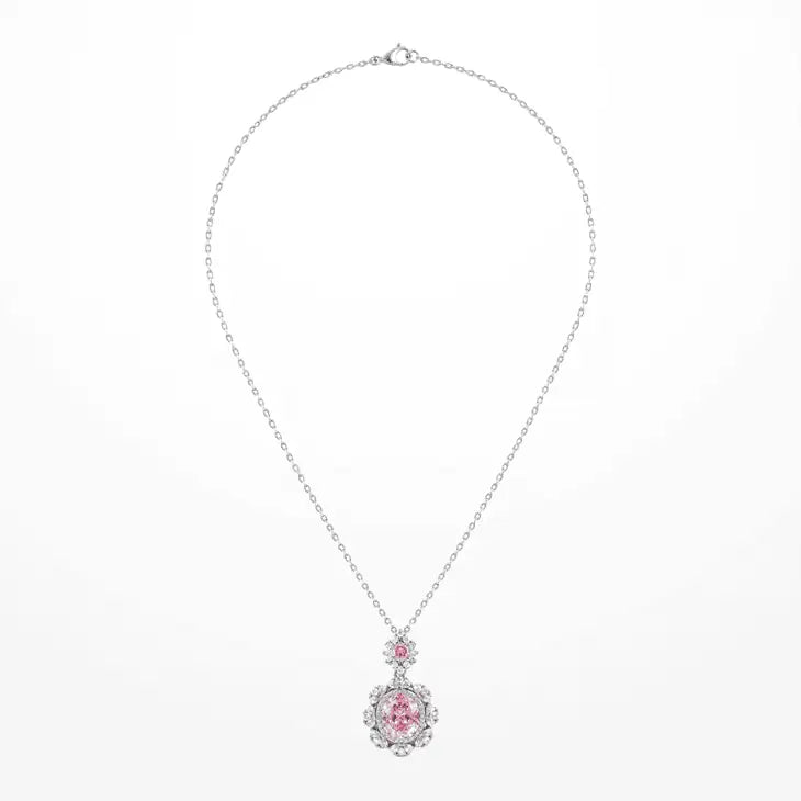 A delicate white gold plated chain necklace featuring a floral pendant with a central oval pink zircon and a smaller round pink zircon above it, set against a plain white background.