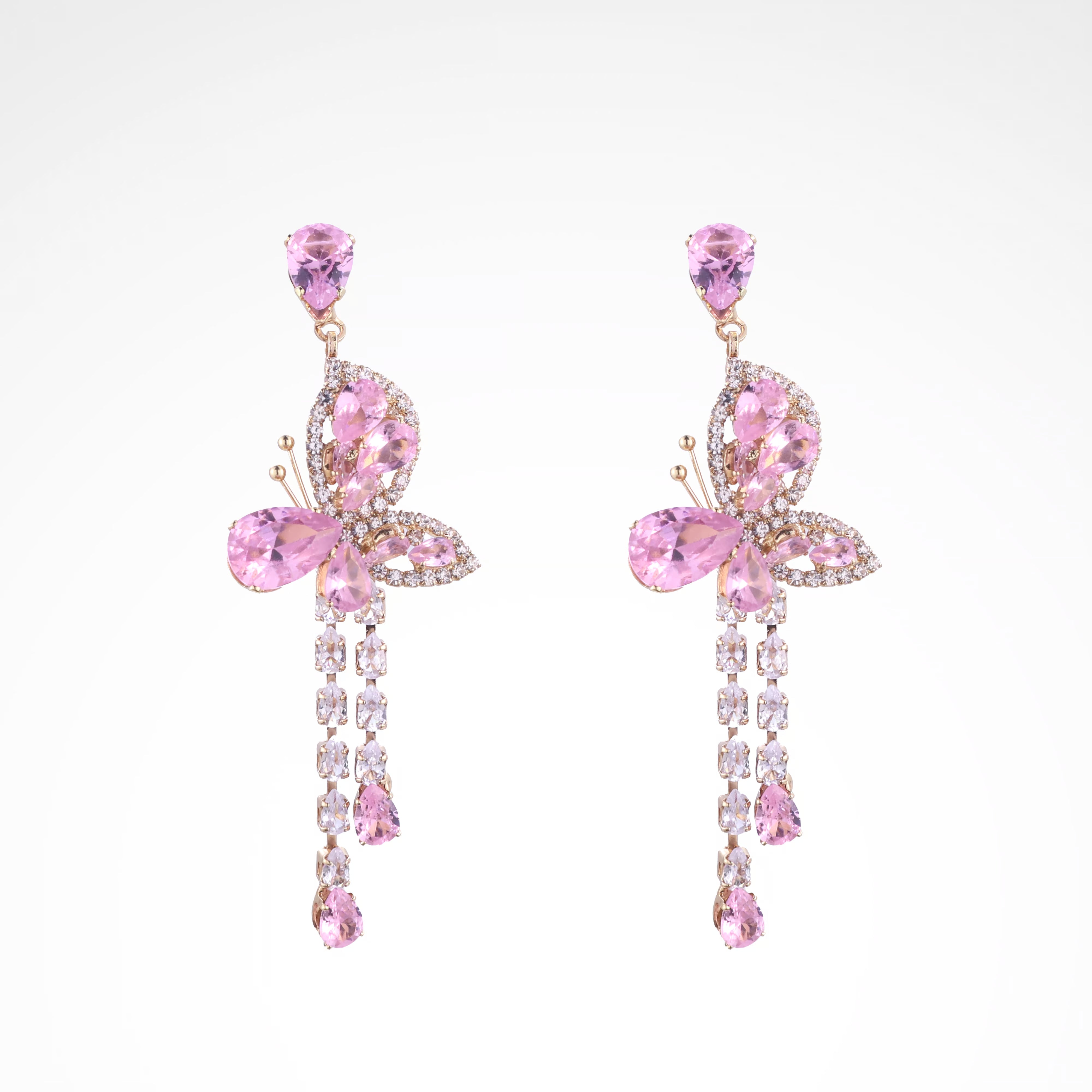 Whimsical Blush Butterfly Crystal Tassel Drop Earrings, white-gold plated copper with zircon stones with a white background